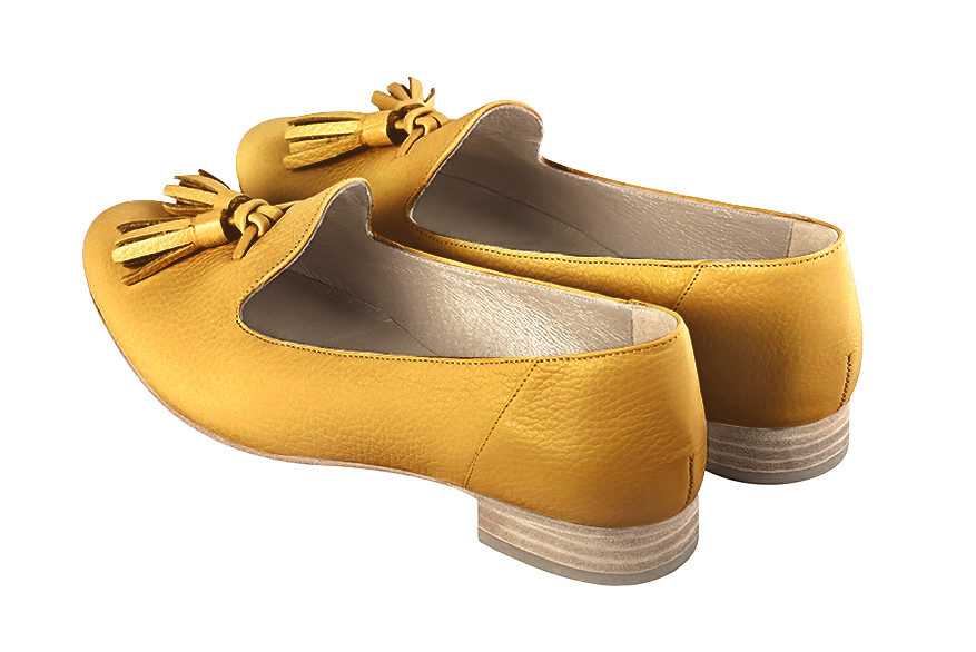 Mustard yellow women's loafers with pompons. Round toe. Flat leather soles. Rear view - Florence KOOIJMAN